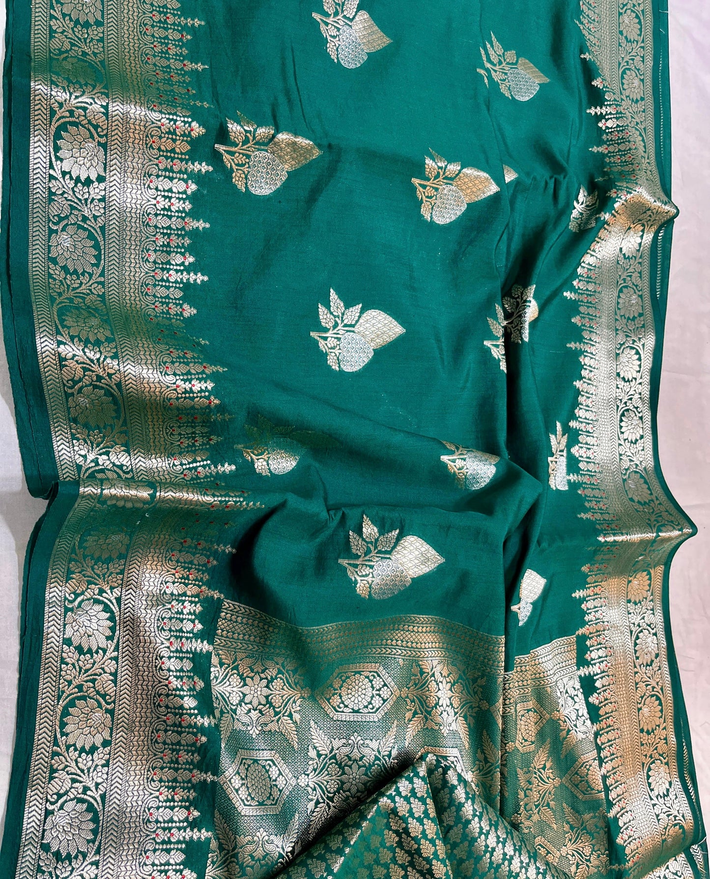 Handloom Pure Chhiniya Silk Saree in bottle green with Meenakari Zari Weaving and Buta Work