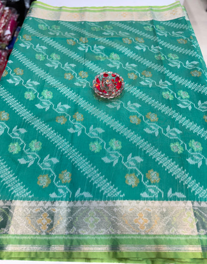 Women’s ikat style woven saree with contrast border and tassel pallu