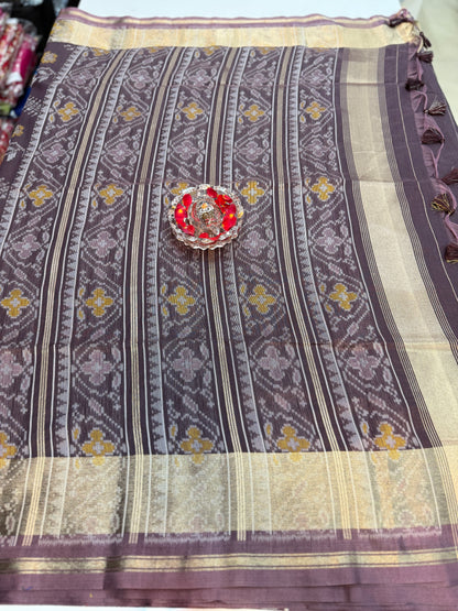 Women’s ikat style woven saree with contrast border and tassel pallu