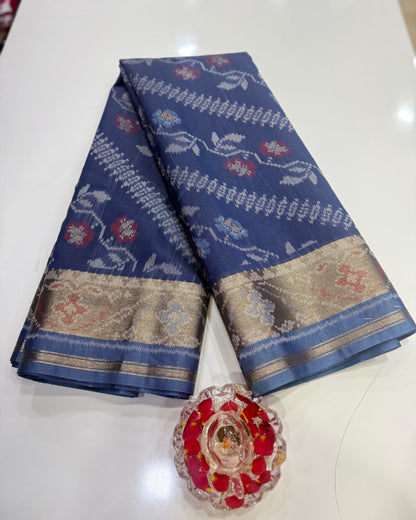 Women’s ikat style woven saree with contrast border and tassel pallu
