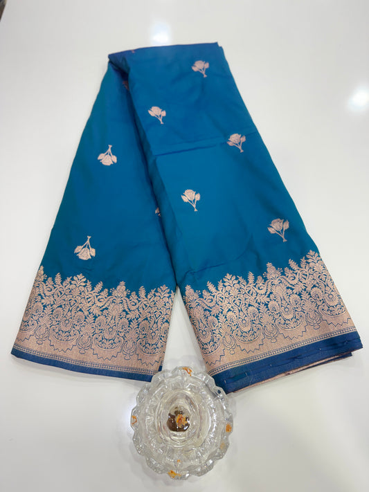 Soft silk saree with woven floral border and contrast brocade blouse piece