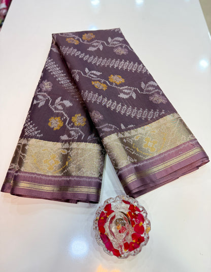 Women’s ikat style woven saree with contrast border and tassel pallu