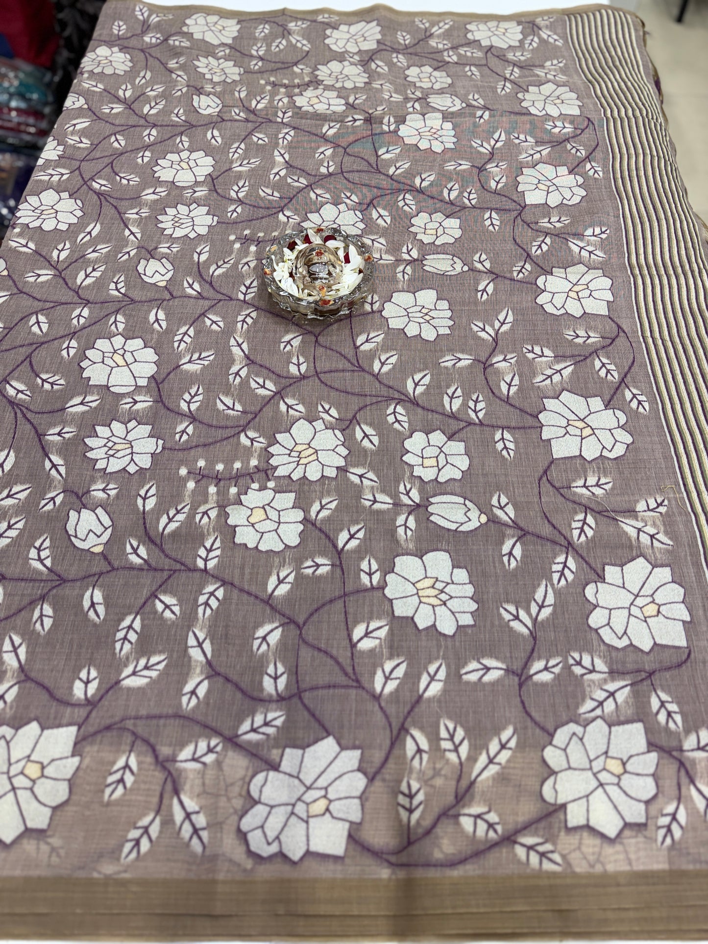 Linen printed saree with floral vine design, contrast border and tassel pallu, women’s daily wear saree