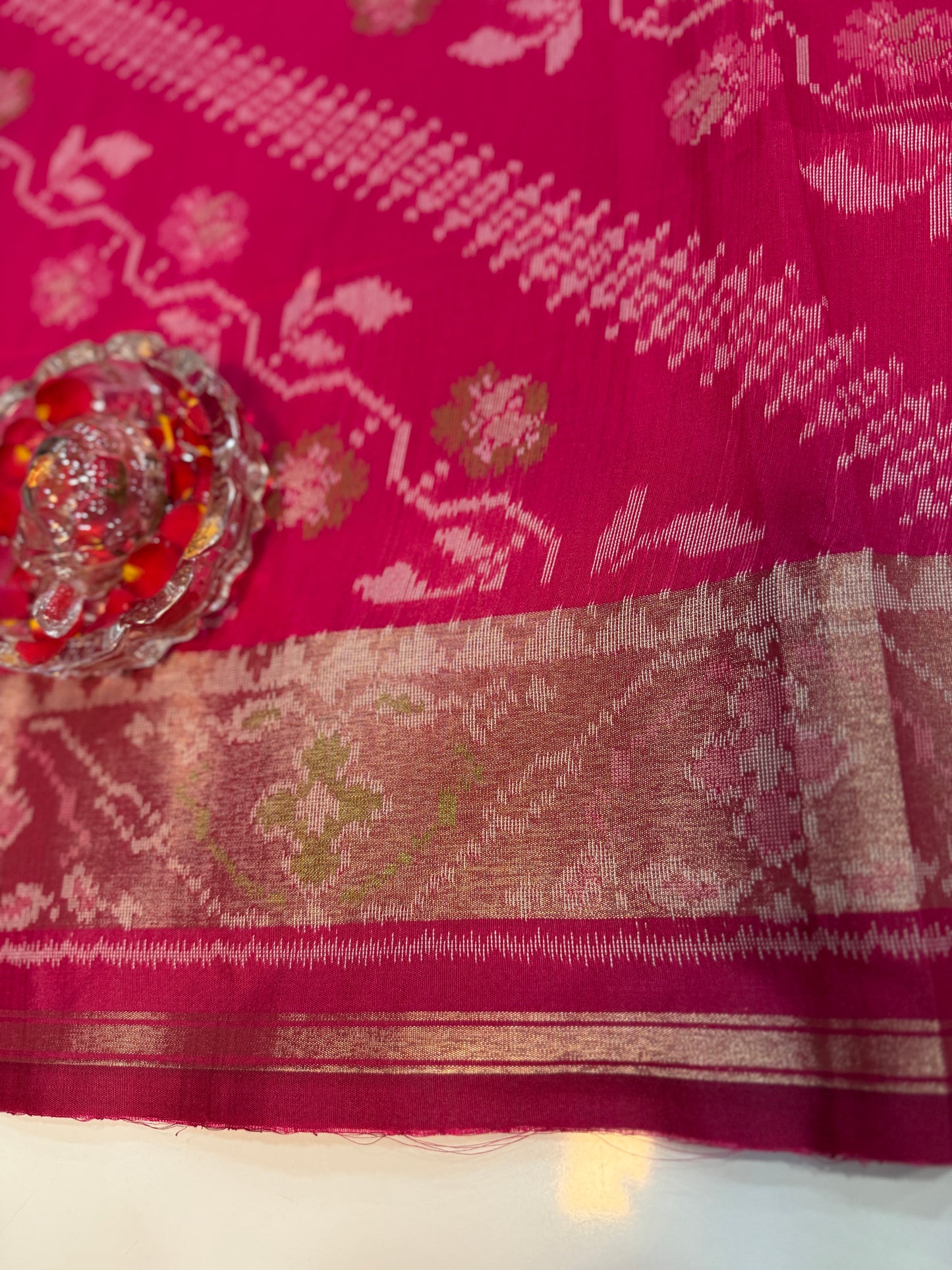 Women’s ikat style woven saree with contrast border and tassel pallu