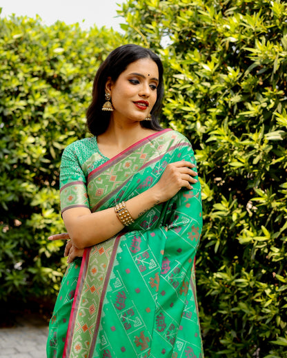 Ikkat Patola Silk Saree with Contrast Zari Weaving and Kanchi Borders – Festive Wear