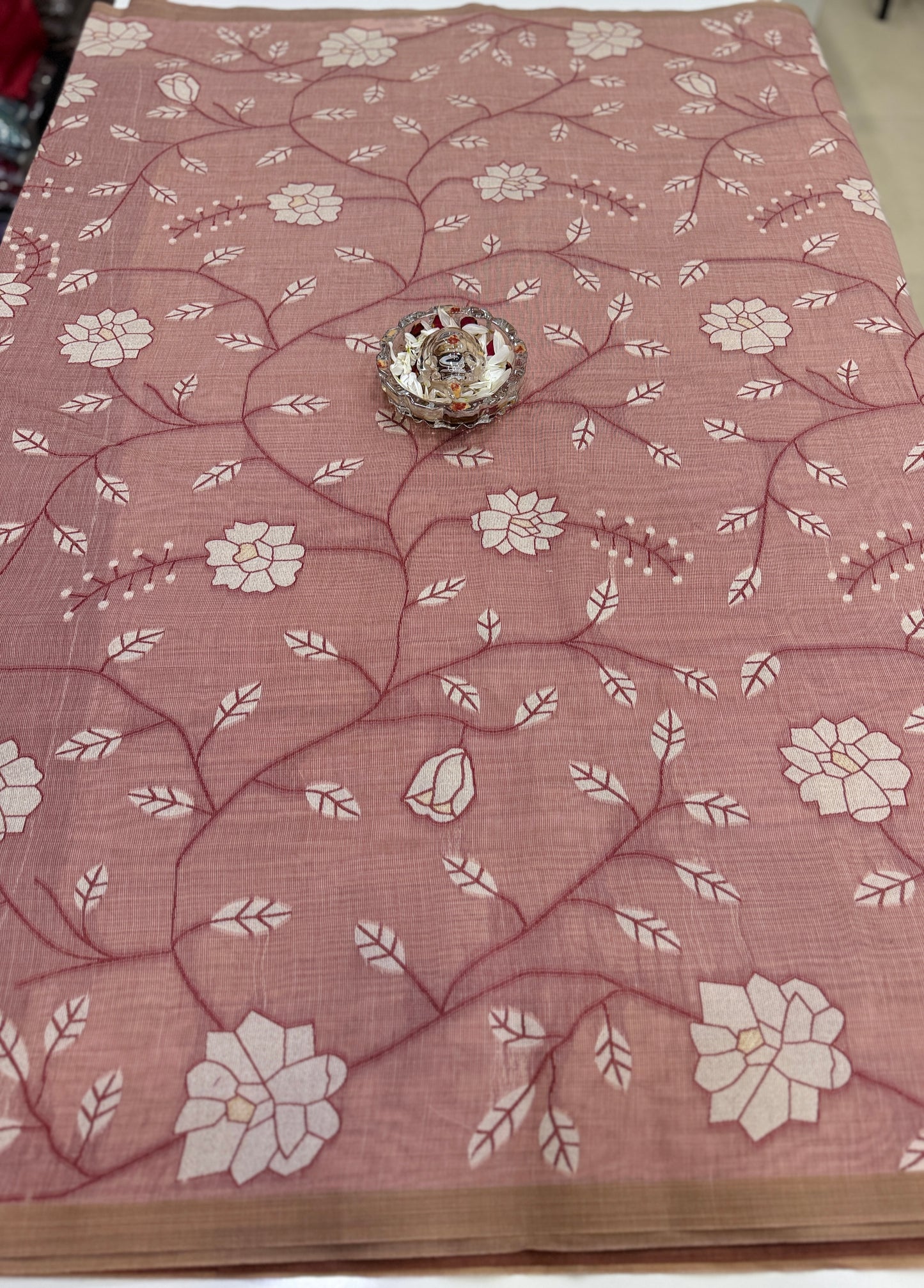 Linen printed saree with floral vine design, contrast border and tassel pallu, women’s daily wear saree