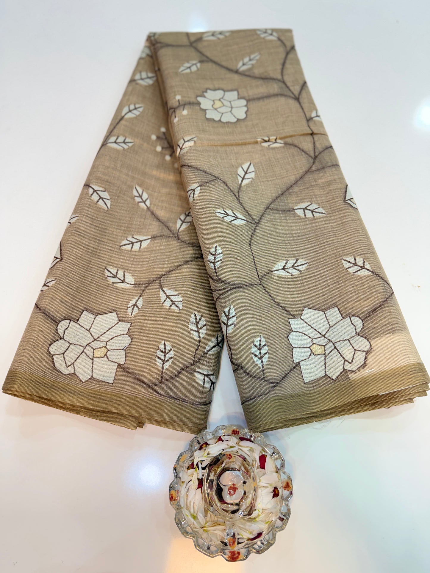 Linen printed saree with floral vine design, contrast border and tassel pallu, women’s daily wear saree