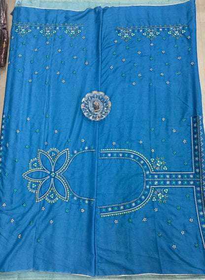 Aqua blue kora silk style viscose saree with woven detailing, tassel pallu and embroidered blouse fabric for women