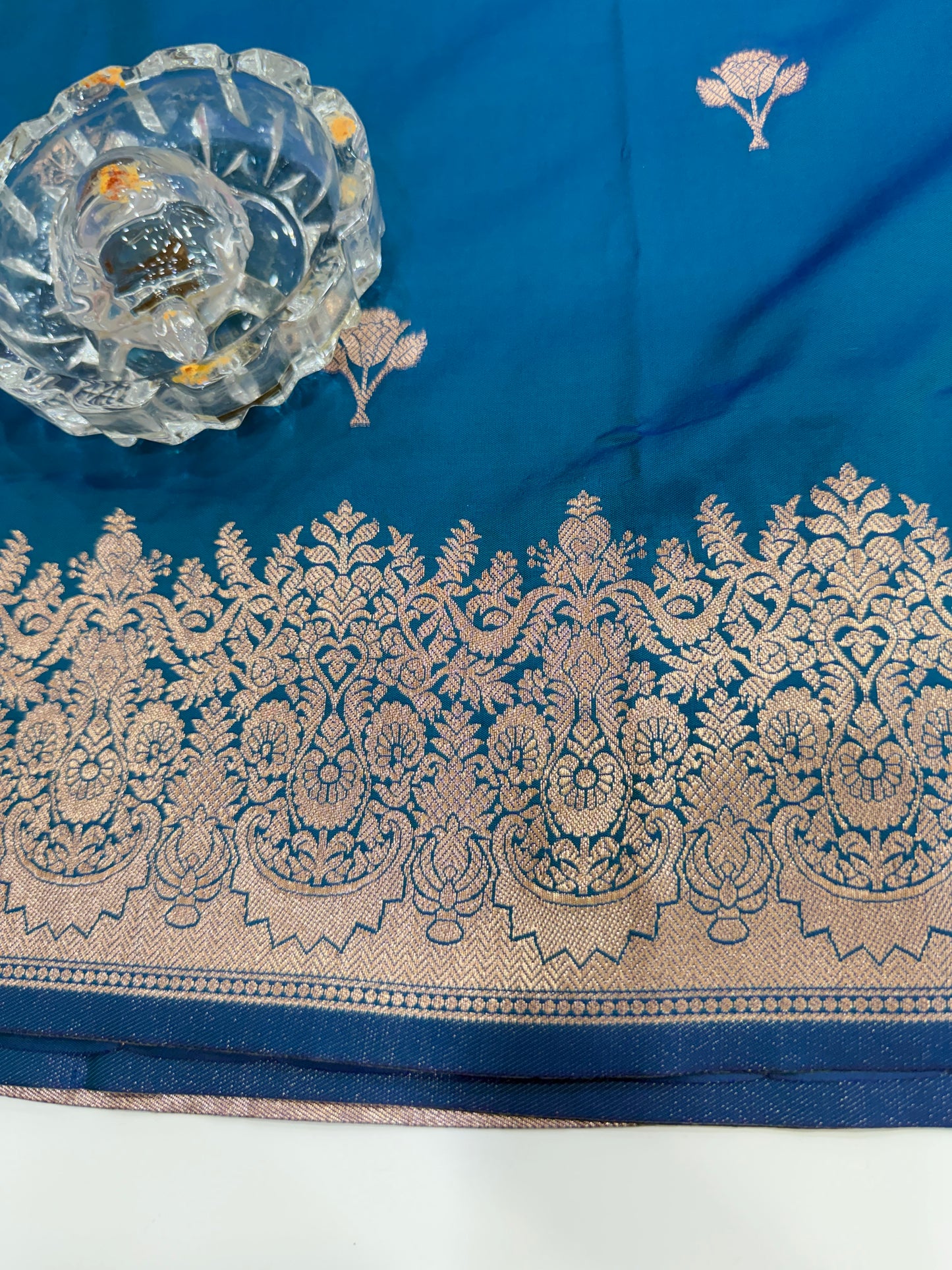 Soft silk saree with woven floral border and contrast brocade blouse piece