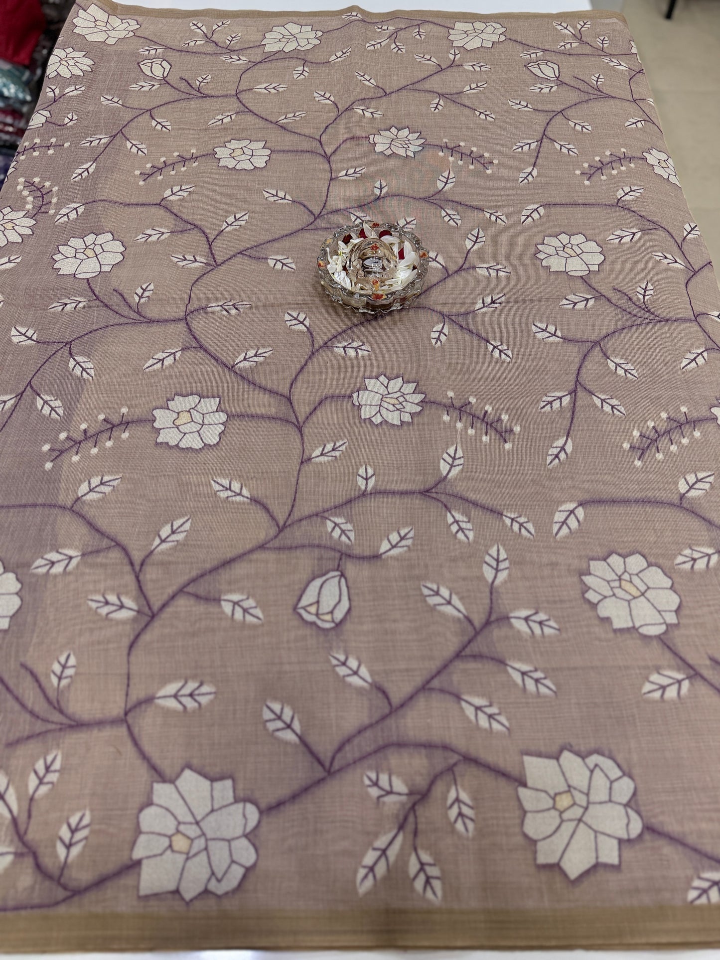 Linen printed saree with floral vine design, contrast border and tassel pallu, women’s daily wear saree