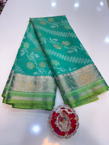 Women’s ikat style woven saree with contrast border and tassel pallu