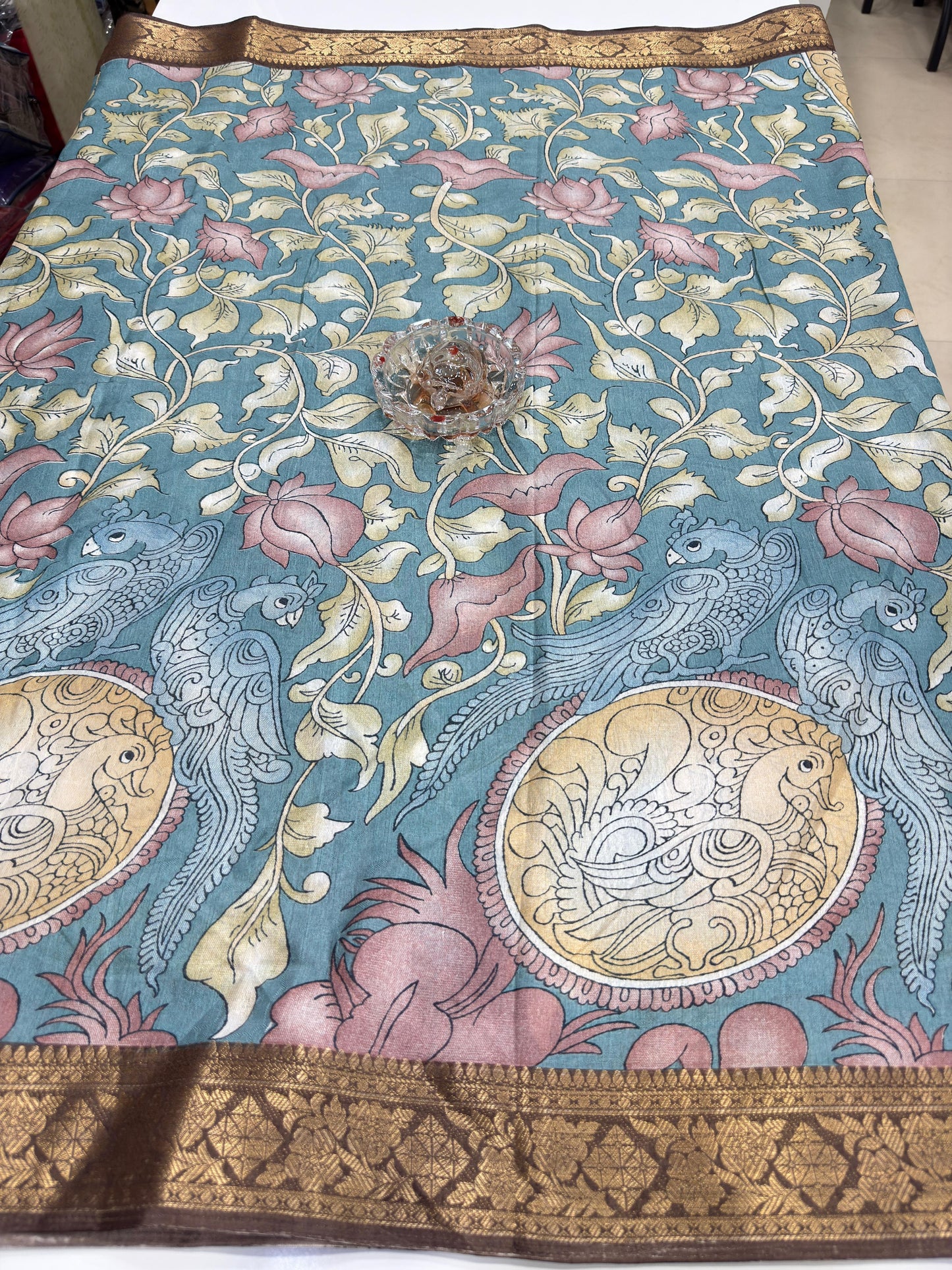 Silk blend printed saree with floral and bird motifs, zari border, women’s festive wear saree