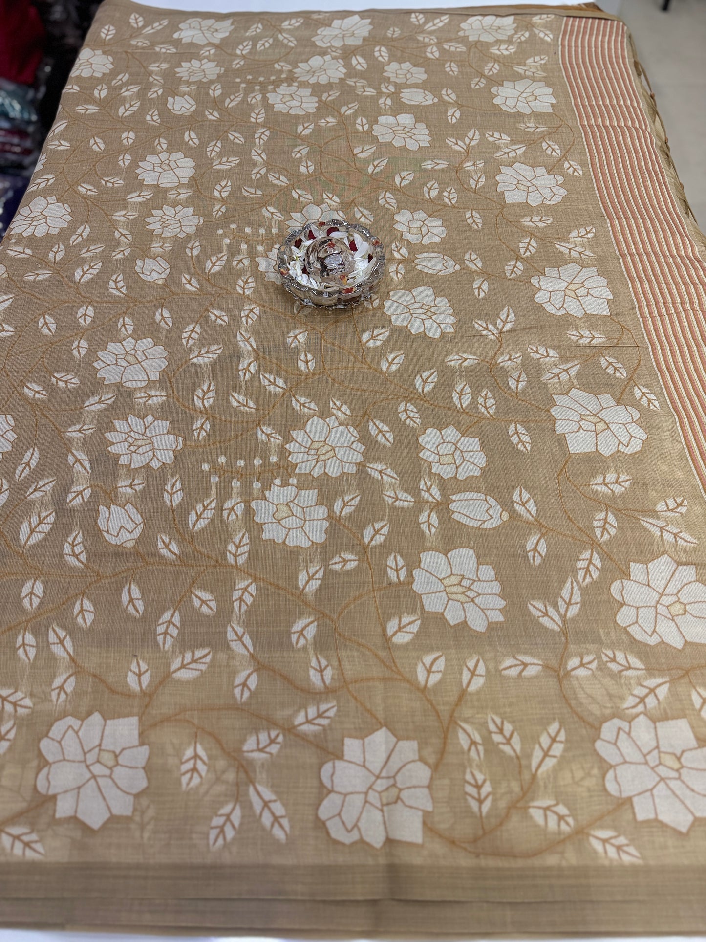 Linen printed saree with floral vine design, contrast border and tassel pallu, women’s daily wear saree