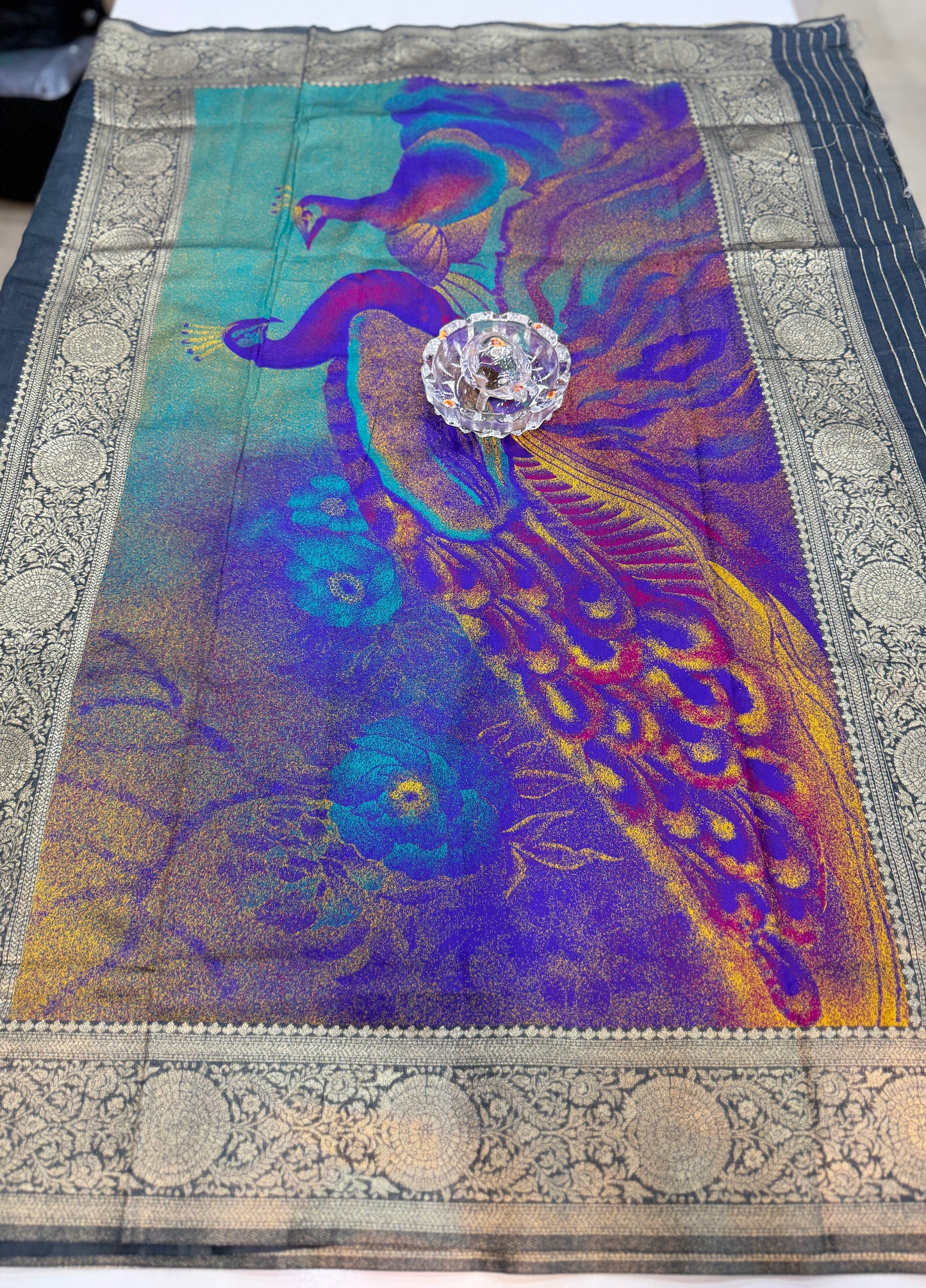 Modal silk saree with woven buttas and peacock pallu for women