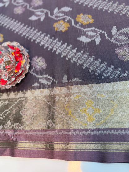 Women’s ikat style woven saree with contrast border and tassel pallu