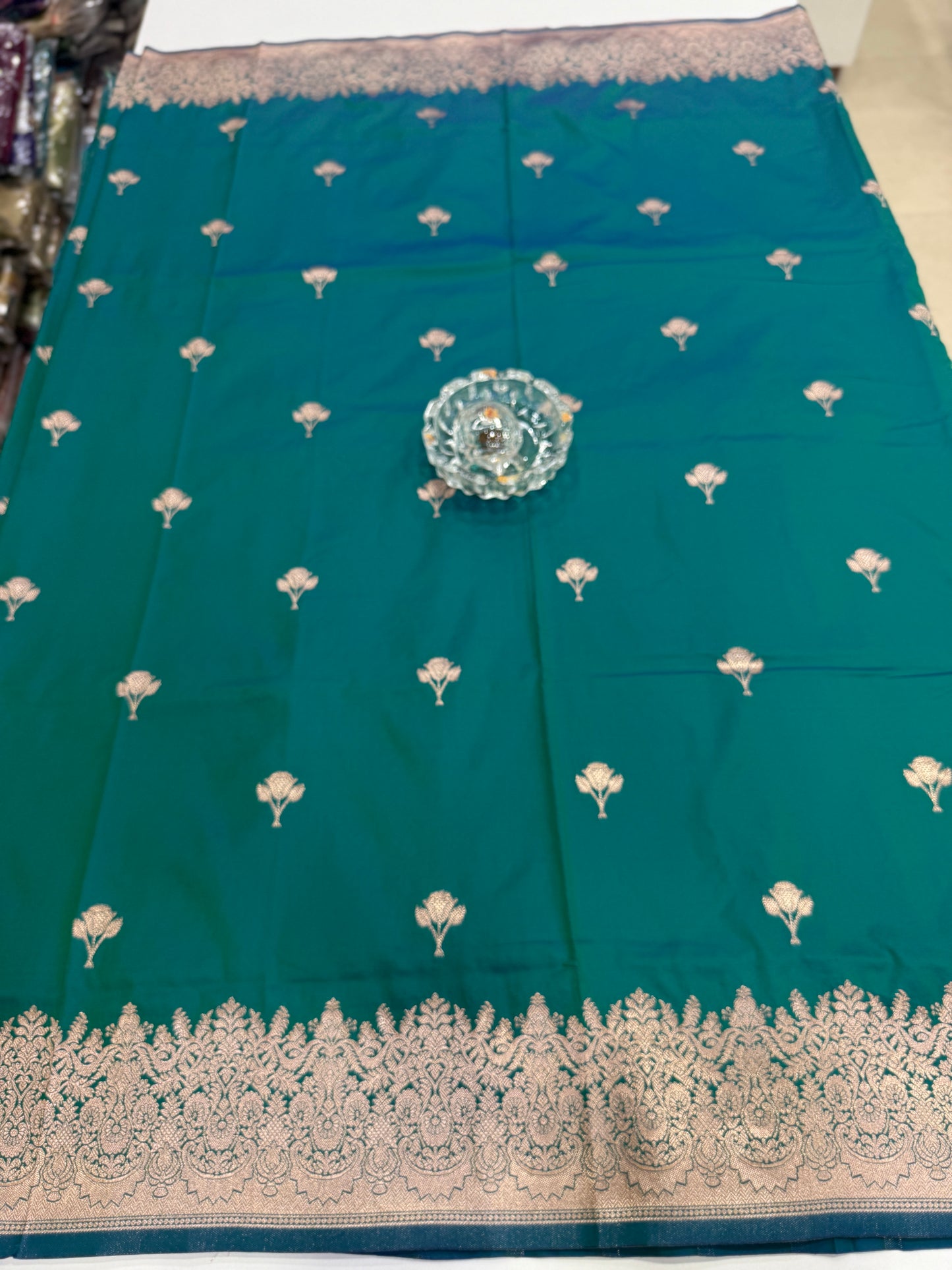 Soft silk saree with woven floral border and contrast brocade blouse piece