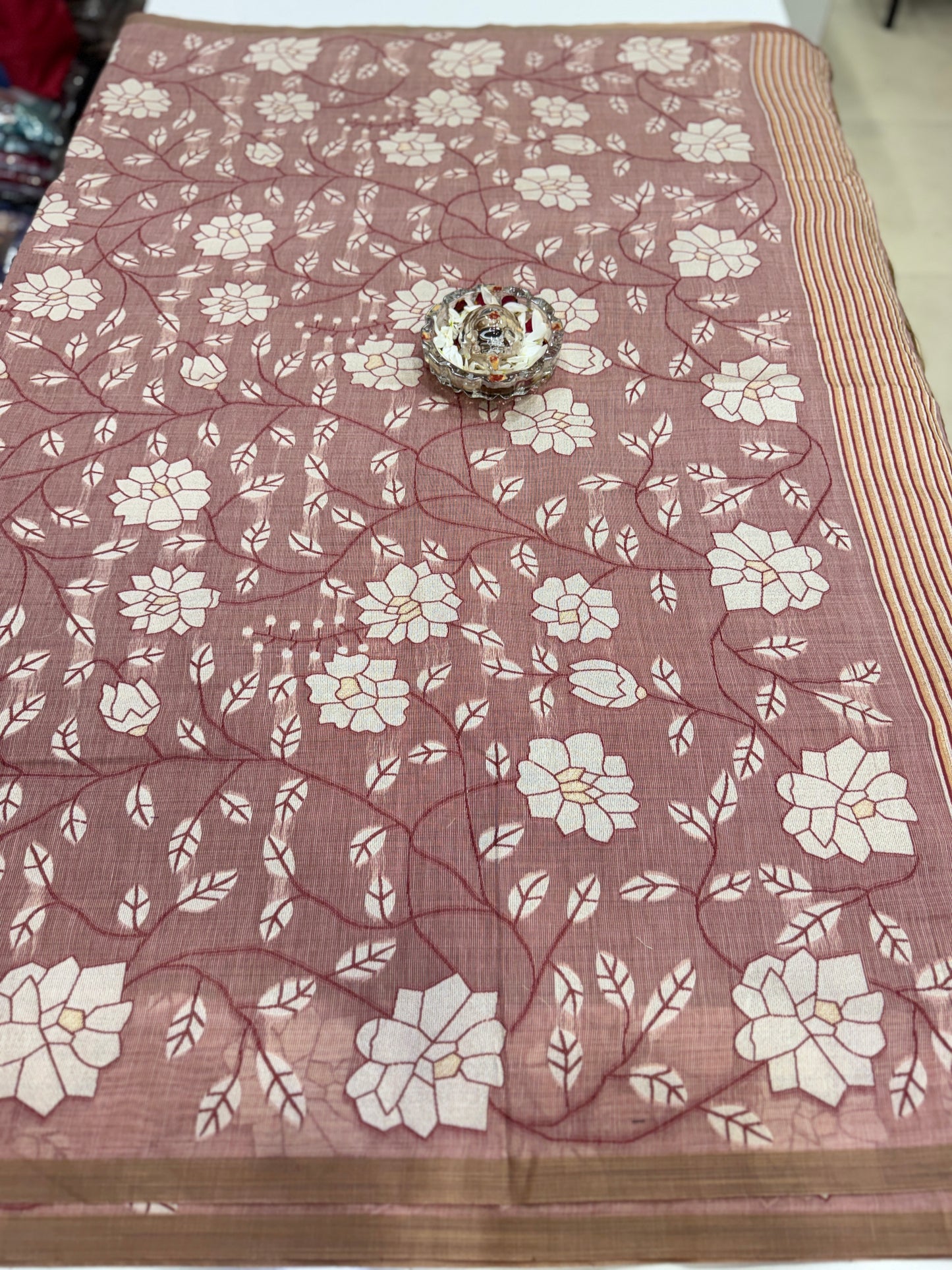 Linen printed saree with floral vine design, contrast border and tassel pallu, women’s daily wear saree