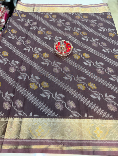 Women’s ikat style woven saree with contrast border and tassel pallu