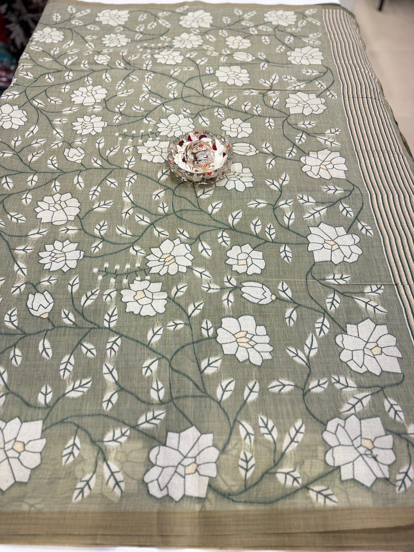 Linen printed saree with floral vine design, contrast border and tassel pallu, women’s daily wear saree