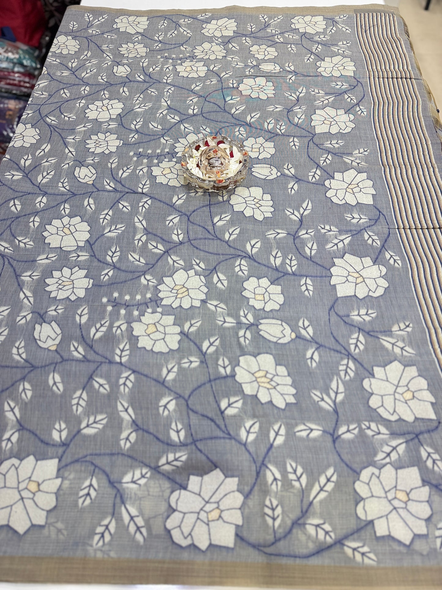 Linen printed saree with floral vine design, contrast border and tassel pallu, women’s daily wear saree