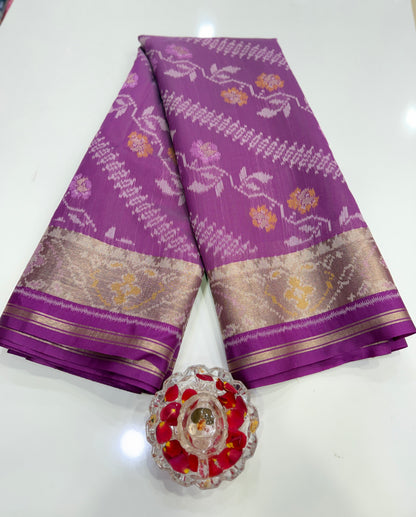 Women’s ikat style woven saree with contrast border and tassel pallu