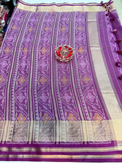 Women’s ikat style woven saree with contrast border and tassel pallu