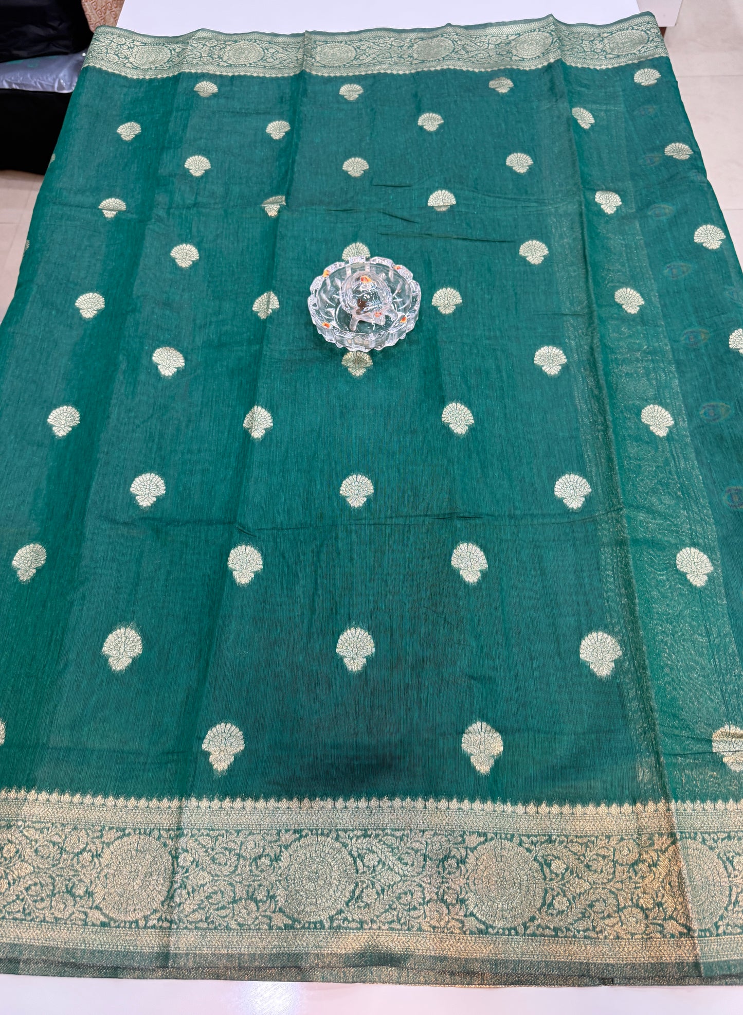 Modal silk saree with woven buttas and peacock pallu for women