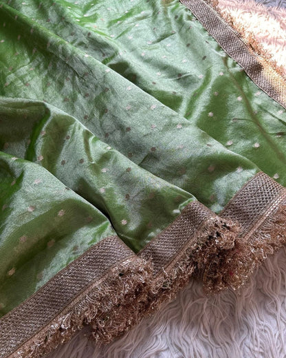 Banarasi Tissue Silk Saree, adorned with exquisite broad shiny lace