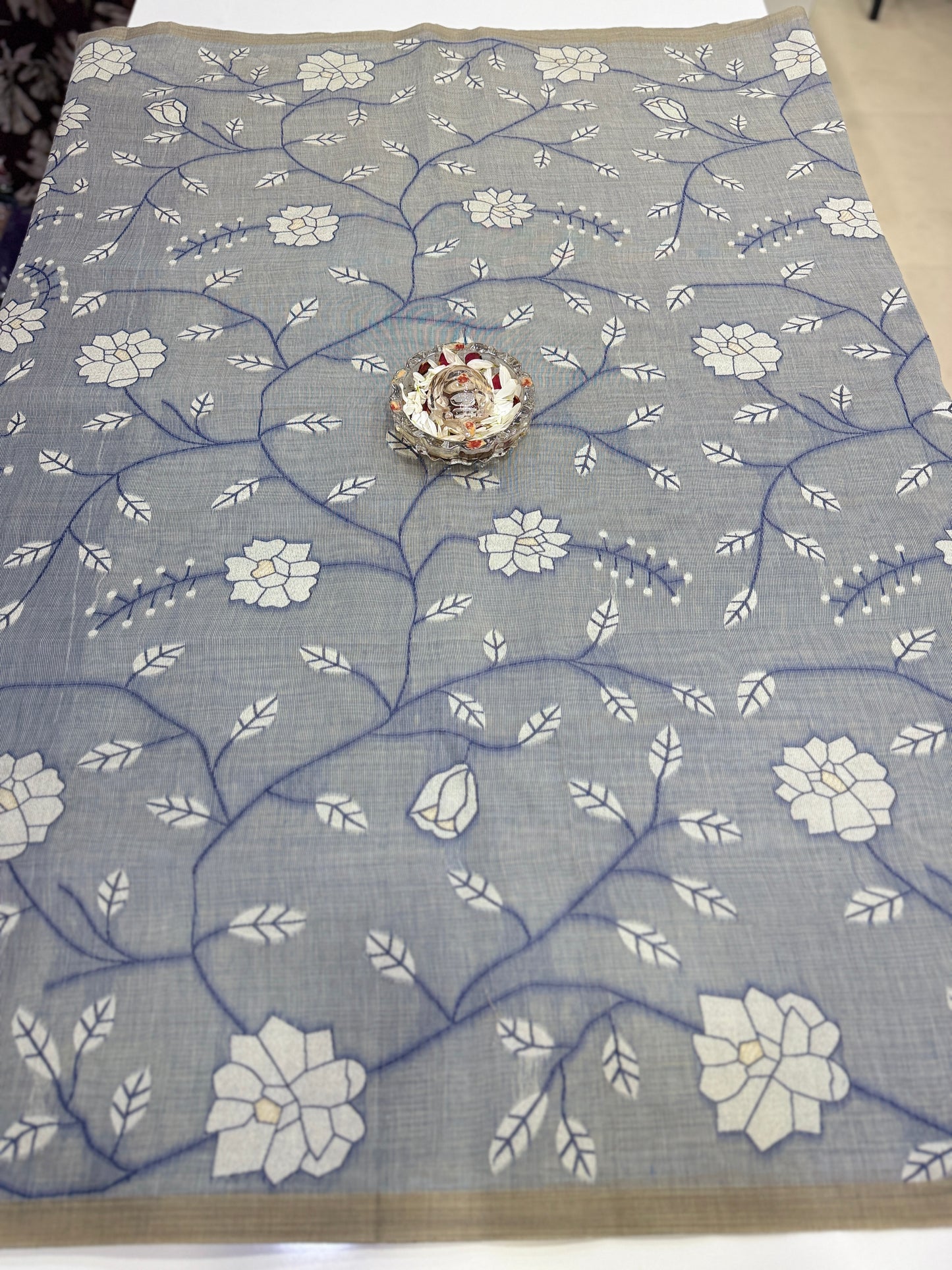 Linen printed saree with floral vine design, contrast border and tassel pallu, women’s daily wear saree