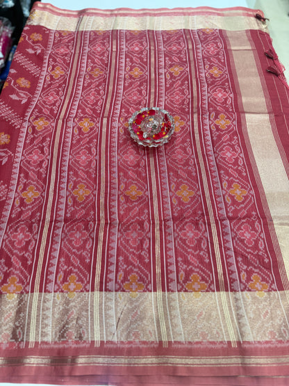 Women’s ikat style woven saree with contrast border and tassel pallu