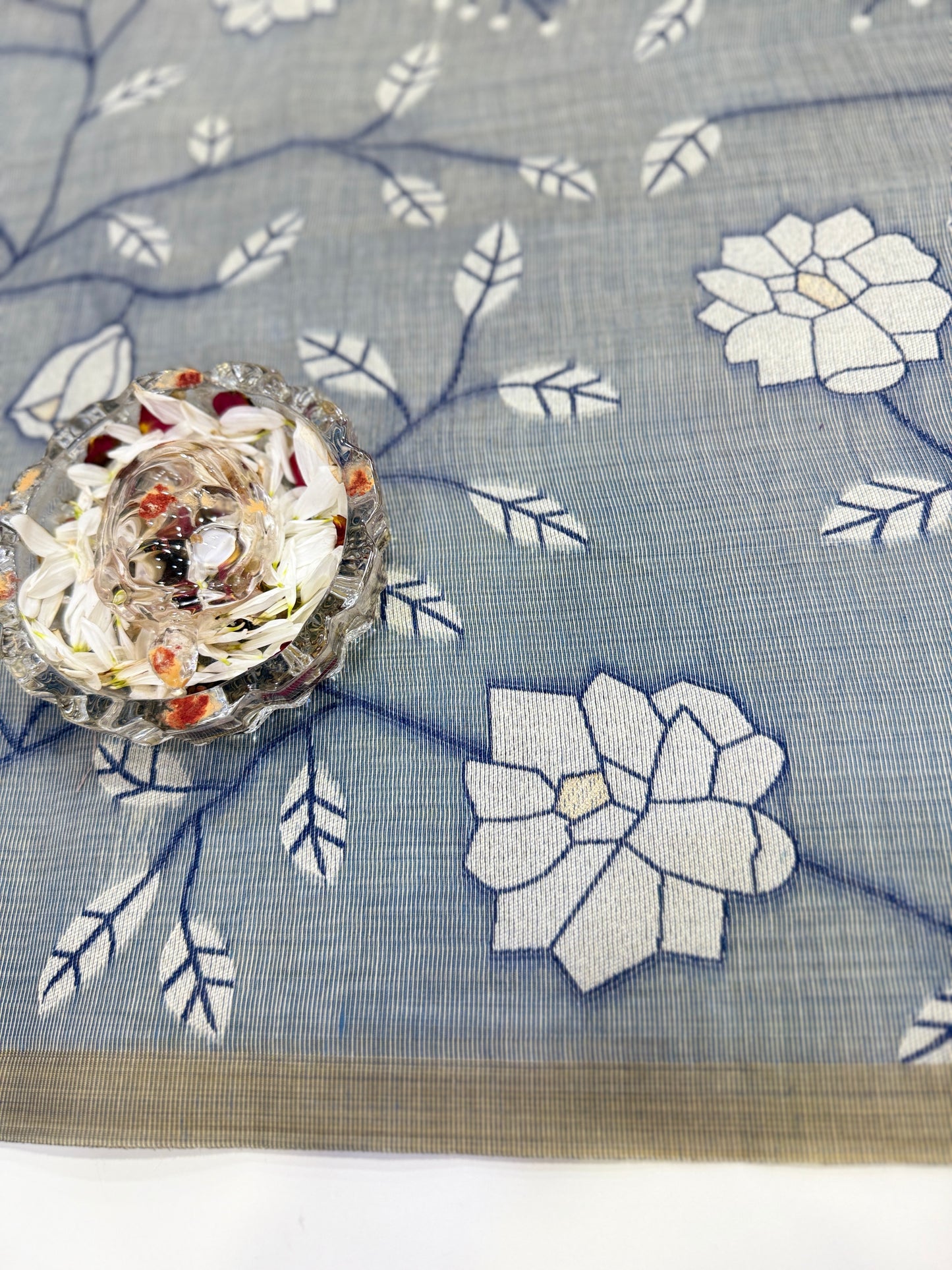 Linen printed saree with floral vine design, contrast border and tassel pallu, women’s daily wear saree