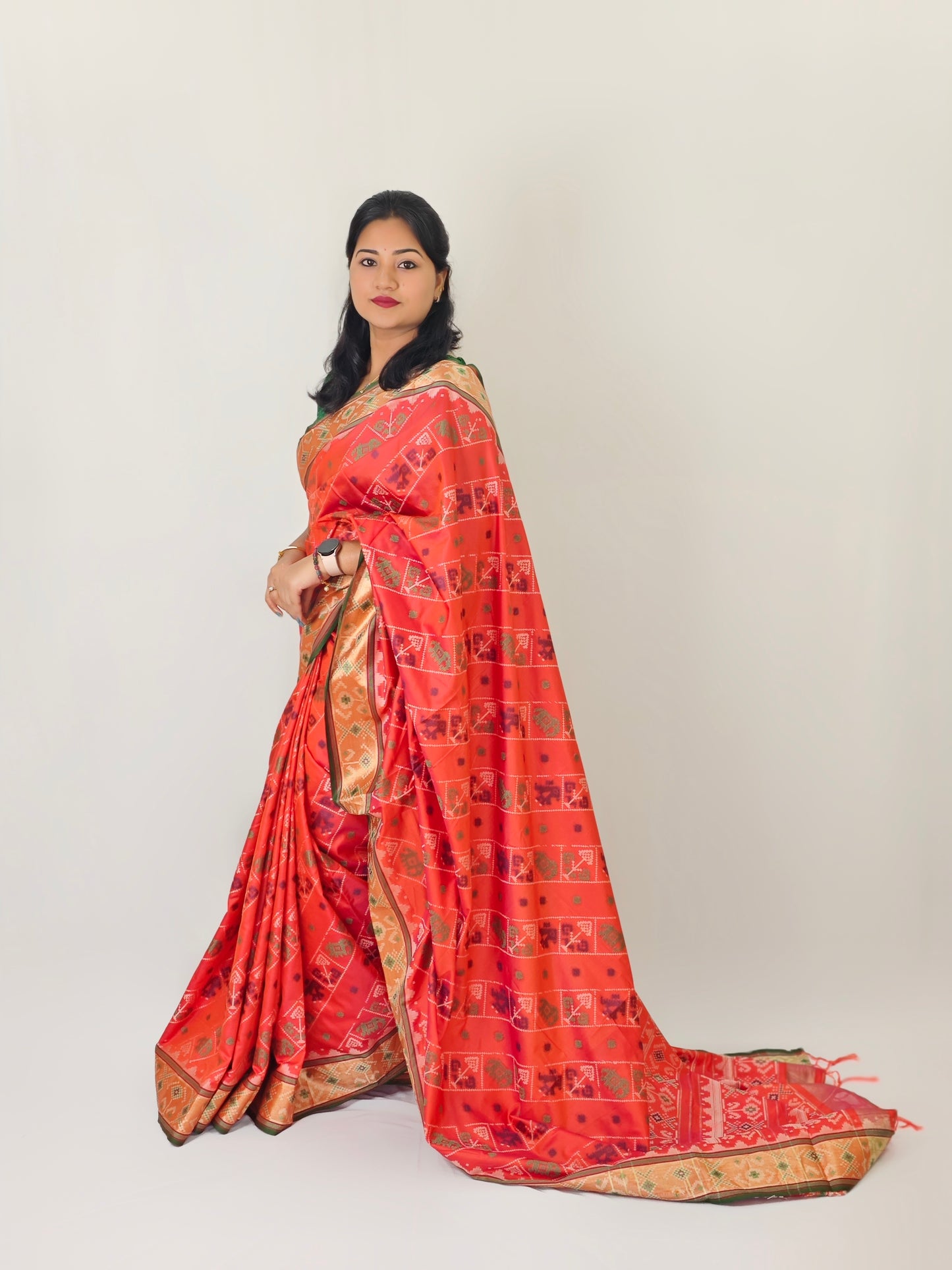 Ikkat Patola Silk Saree with Contrast Zari Weaving and Kanchi Borders – Festive Wear