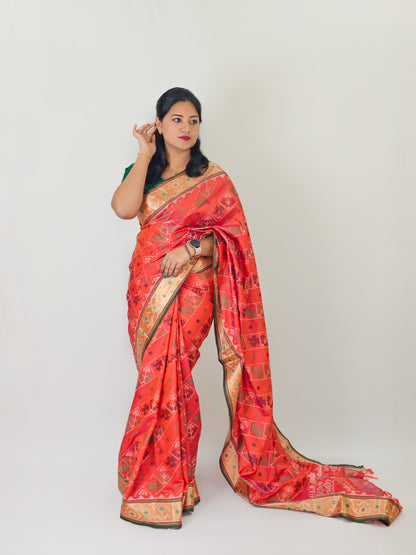 Ikkat Patola Silk Saree with Contrast Zari Weaving and Kanchi Borders – Festive Wear