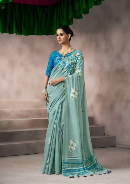 Aqua blue kora silk style viscose saree with woven detailing, tassel pallu and embroidered blouse fabric for women