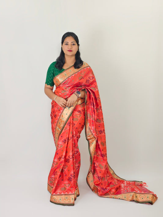 Ikkat Patola Silk Saree with Contrast Zari Weaving and Kanchi Borders – Festive Wear